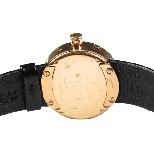 510 - CHANNEL: AN 18CT GOLD WRISTWATCH

with quartz movement, black dial, gold hands, on a black leather s... 