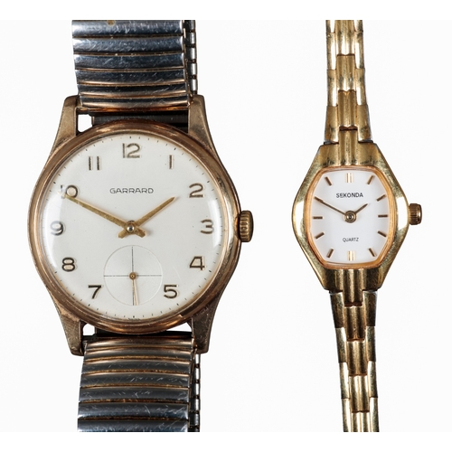 520 - GARRARD: A 9CT GOLD WRISTWATCH

with manual wind movement, silver dial, subsidiary seconds dial, gol... 