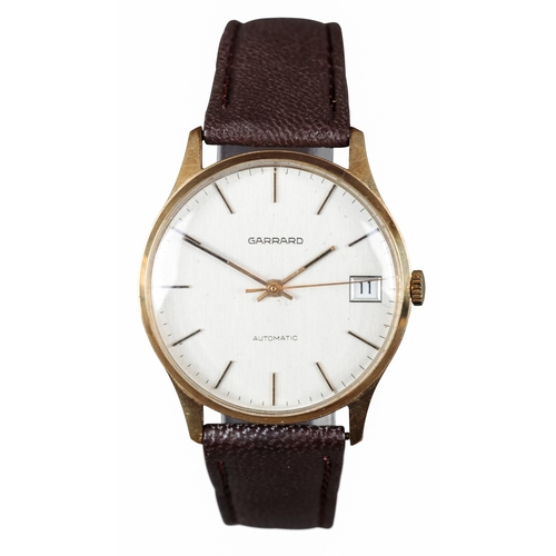 521 - GARRARD: A 9CT GOLD WRISTWATCH

with automatic movement, grey dial, gold baton numerals, gold hands,... 
