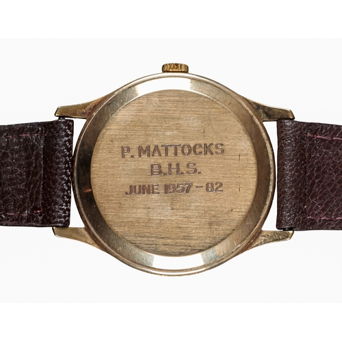521 - GARRARD: A 9CT GOLD WRISTWATCH

with automatic movement, grey dial, gold baton numerals, gold hands,... 