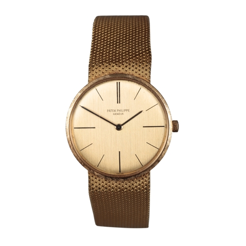 548 - PATEK PHILIPPE: AN 18K GOLD CALATRAVA BRACELET WATCH

with manual wind movement, gold dial, black ba... 