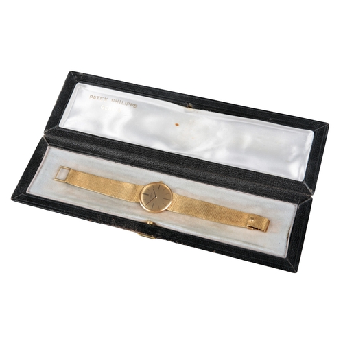 548 - PATEK PHILIPPE: AN 18K GOLD CALATRAVA BRACELET WATCH

with manual wind movement, gold dial, black ba... 
