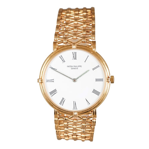 549 - PATEK PHILLIPE CALATRAVA: AN 18CT GOLD BRACELET WATCH

with manual wind movement, white enamel dial,... 