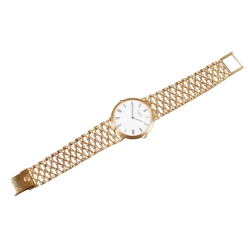 549 - PATEK PHILLIPE CALATRAVA: AN 18CT GOLD BRACELET WATCH

with manual wind movement, white enamel dial,... 