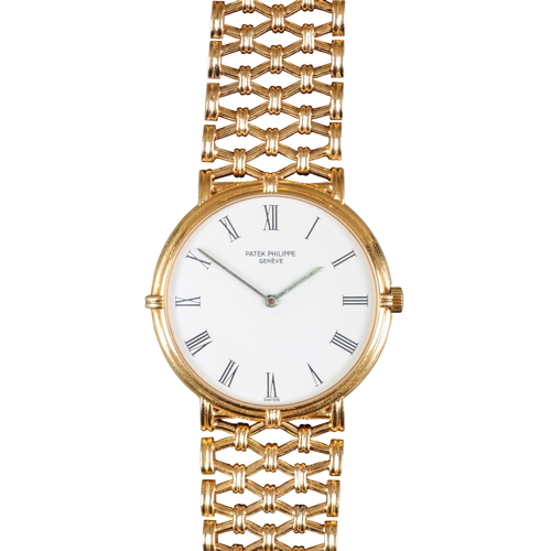 549 - PATEK PHILLIPE CALATRAVA: AN 18CT GOLD BRACELET WATCH

with manual wind movement, white enamel dial,... 