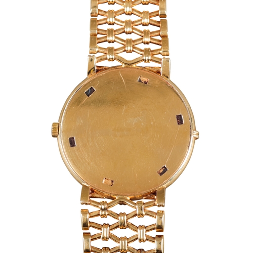 549 - PATEK PHILLIPE CALATRAVA: AN 18CT GOLD BRACELET WATCH

with manual wind movement, white enamel dial,... 