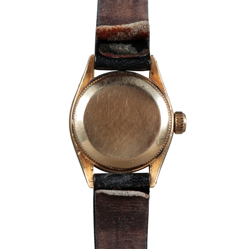 558 - ROLEX OYSTER PERPETUAL DATE: AN 18CT GOLD WRISTWATCH

with automatic movement, black dial, gold bato... 