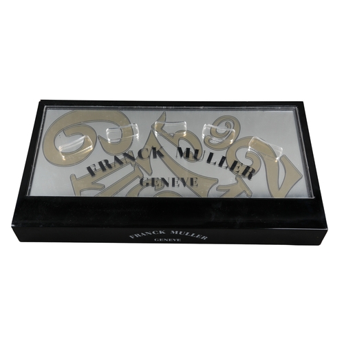 593 - FRANCK MULLER OF GENEVA: TWO SHOP ADVERTISING DISPLAYS

40cm x 43cm, 15cm x 55cm; together with a Ba... 
