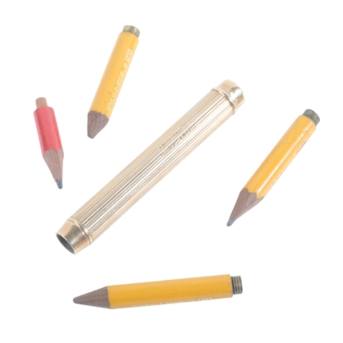 632 - A 9CT GOLD PENCIL BY MORDAN & CO.

the reeded barrel with cartouche dated 19th September 1913, 8cm l... 