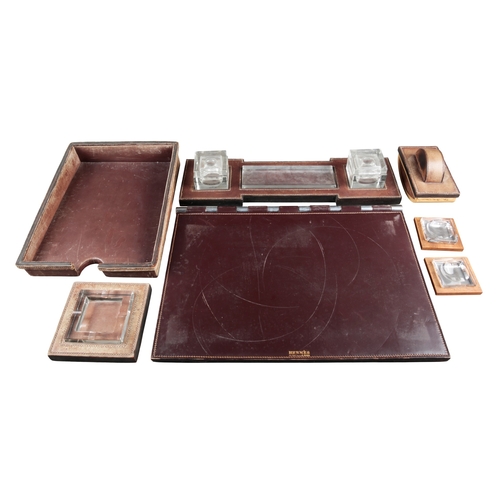 633 - PAUL DUPRE-LAFON (1900-1971) FOR HERMES: A 1930S OXBLOOD LEATHER DESK SET

comprising pad, 55cm x 36... 