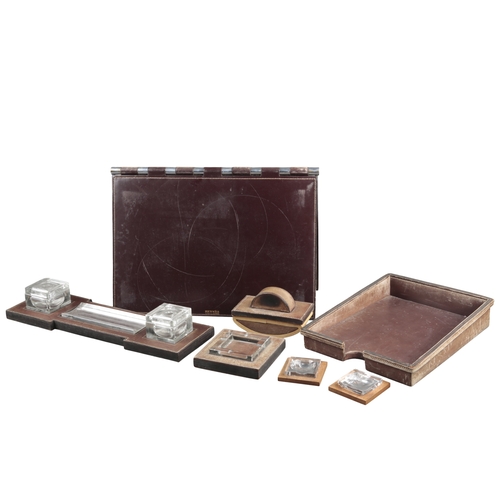 633 - PAUL DUPRE-LAFON (1900-1971) FOR HERMES: A 1930S OXBLOOD LEATHER DESK SET

comprising pad, 55cm x 36... 