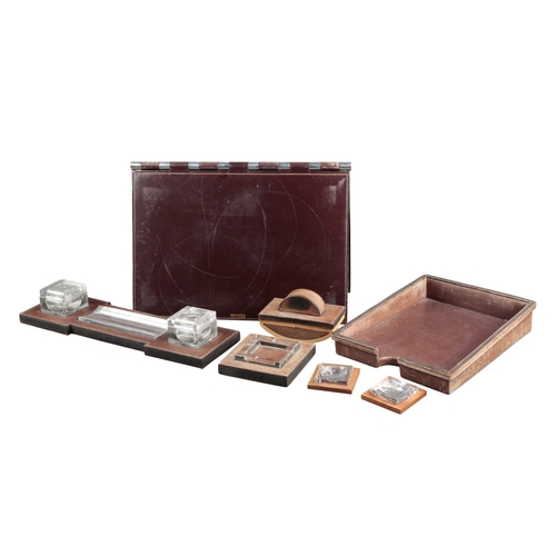 633 - PAUL DUPRE-LAFON (1900-1971) FOR HERMES: A 1930S OXBLOOD LEATHER DESK SET

comprising pad, 55cm x 36... 