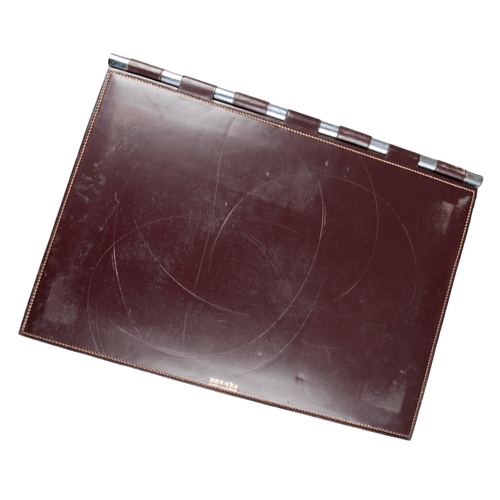 633 - PAUL DUPRE-LAFON (1900-1971) FOR HERMES: A 1930S OXBLOOD LEATHER DESK SET

comprising pad, 55cm x 36... 