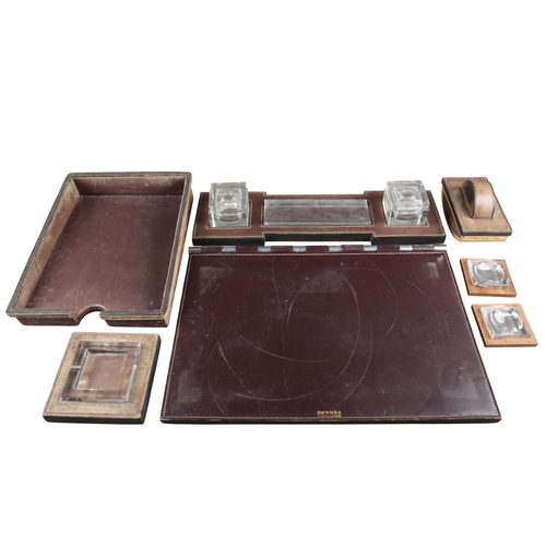 633 - PAUL DUPRE-LAFON (1900-1971) FOR HERMES: A 1930S OXBLOOD LEATHER DESK SET

comprising pad, 55cm x 36... 