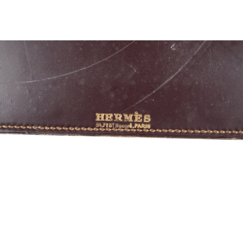 633 - PAUL DUPRE-LAFON (1900-1971) FOR HERMES: A 1930S OXBLOOD LEATHER DESK SET

comprising pad, 55cm x 36... 