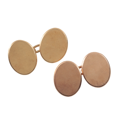 306 - A PAIR OF 18CT GOLD CUFFLINKS

the cufflinks with two engine turned angular oval panels connected wi... 