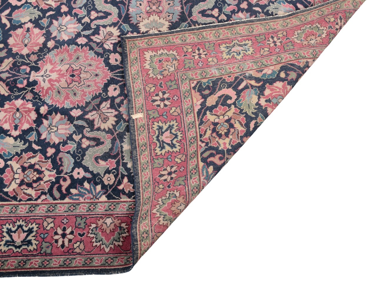 A PERSIAN BIJAR RUG woven in turquoise, pink and other colours with ...