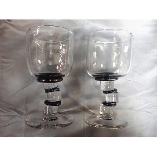 270 - ANNETTE MEECH, B.1948: A PAIR OF WINE GLASSES1990, the stems of eccentric blocked design, with black... 