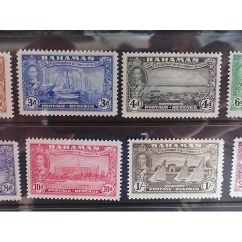 462 - ENVELOPE WITH FIVE COMPLETE MINT STAMP SETScomprising Bahamas, British Guyana, Dominica, and Fiji... 