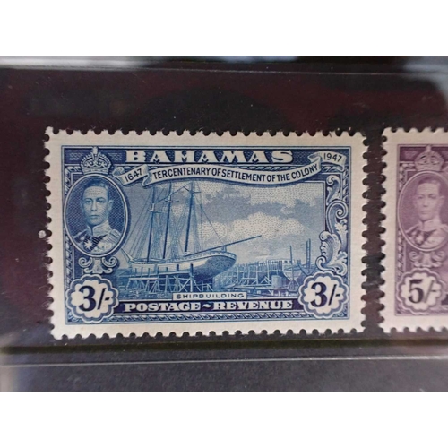 462 - ENVELOPE WITH FIVE COMPLETE MINT STAMP SETScomprising Bahamas, British Guyana, Dominica, and Fiji... 