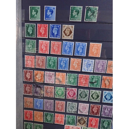 483 - A LARGE QUALITY GREEN ALBUM AND SLIPCASEtogether with three other stock books with Commonwealth/GB s... 