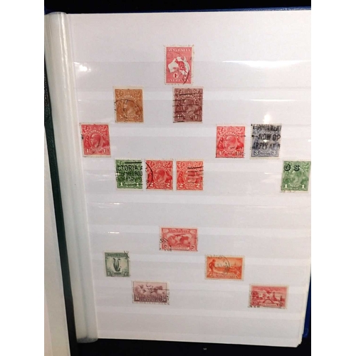 483 - A LARGE QUALITY GREEN ALBUM AND SLIPCASEtogether with three other stock books with Commonwealth/GB s... 