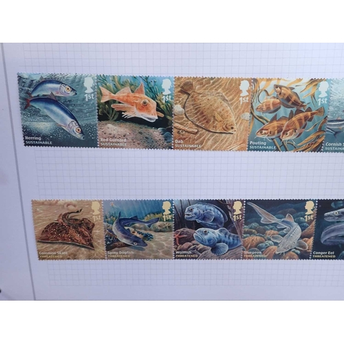 486 - MOSTLY GB STAMP COLLECTIONwith QE mint from late 1960s to circa. 2017 in 12 vols, commems and defins... 