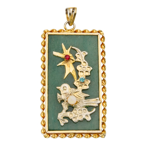 131 - A CHINESE BOWENITE SERPENTINE PENDANT with gold plated mounts and set with paste and an opal, 58mm d... 