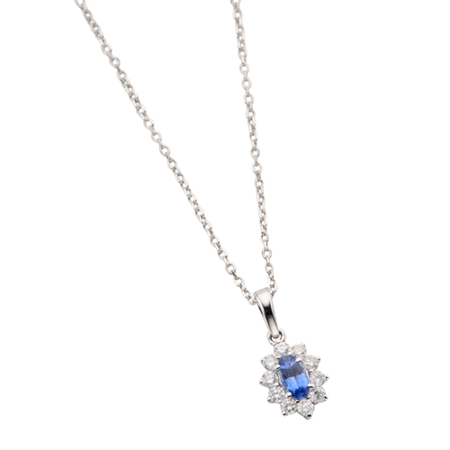 146 - AN 18CT WHITE GOLD SAPPHIRE AND DIAMOND CLUSTER PENDANT NECKLACE the oval mixed cut sapphire 0.22ct ... 