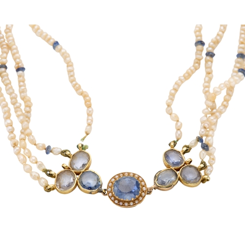 155 - A FOUR-STRAND FRESHWATER SEED PEARL NECKLACE WITH SAPPHIRE SET CLASP the oval mixed cut sapphire, ap... 