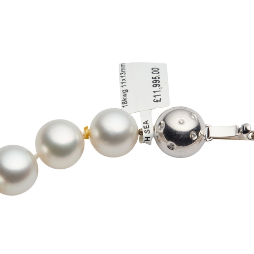 162 - A STRING OF SOUTH SEA PEARLS the thirty five cultured pearls, 11mm to 13mm diameter, with diamond se... 