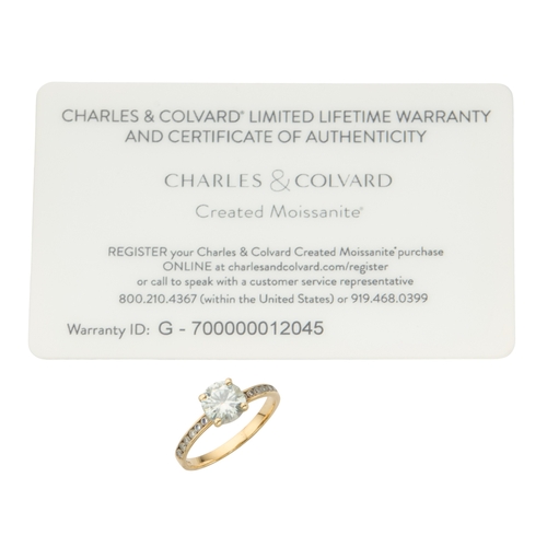 173 - A MOISSANITE SOLITAIRE RING the four claw set round brilliant cut moissanite approximately 7.2mm dia... 