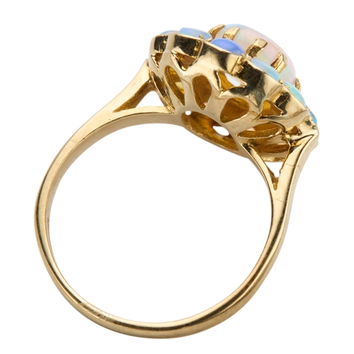 177 - A 9CT YELLOW GOLD ETHIOPIAN OPAL CLUSTER RING the oval central cabochon surrounded by twelve round c... 