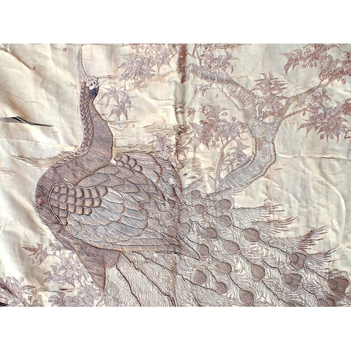 62 - AN EMBROIDERED SILK BEDSPREADwith other textiles