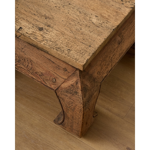 198 - A DISTRESSED STAINED PINE OPIUM TABLE the rectangular top over bold bombe-shaped legs, 44cm high x 7... 