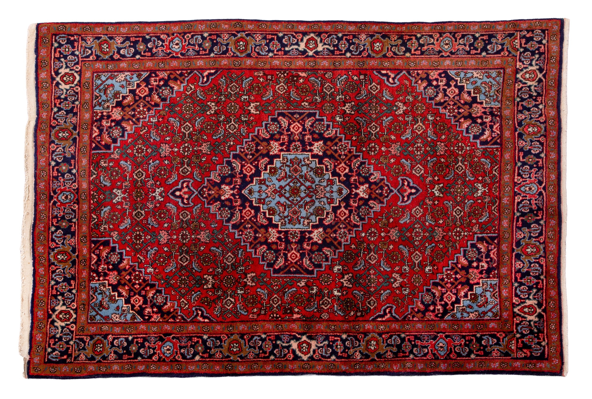 A PERSIAN RUG 20th century, the red ground decorated with a floral ...