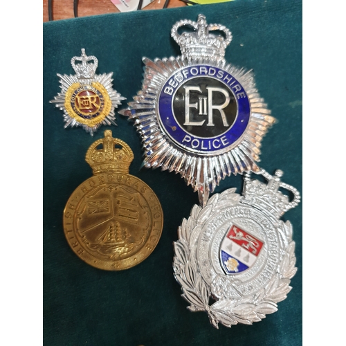 233 - Four police badges