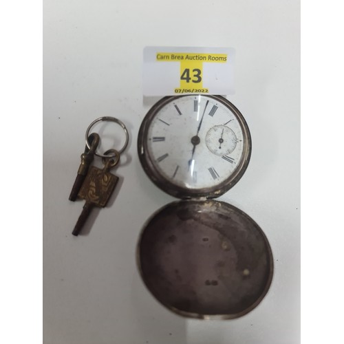 43 - Silver hallmarked pocket watch with key