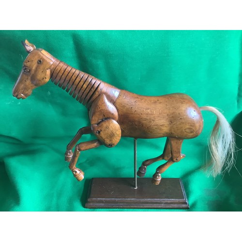 114 - Model Articulated Hard wood Art horse 
Real horse hair tail
10” long x 10” high 
By. AM seal to base