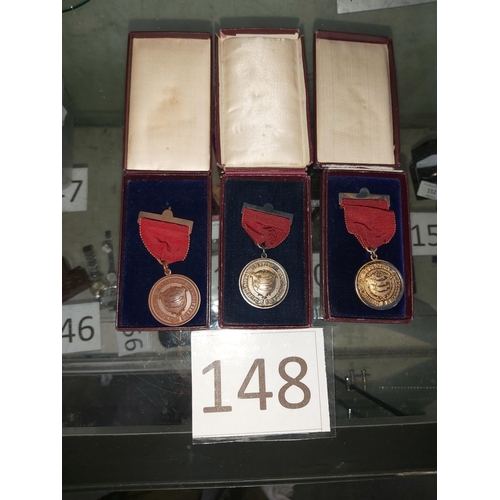 148 - 3 medals in cases