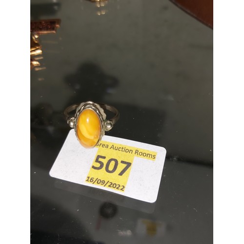 507 - Rare colour Amber ring, white metal