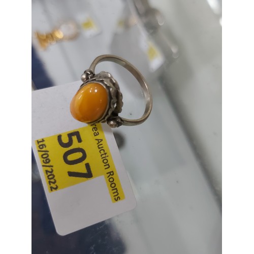 507 - Rare colour Amber ring, white metal