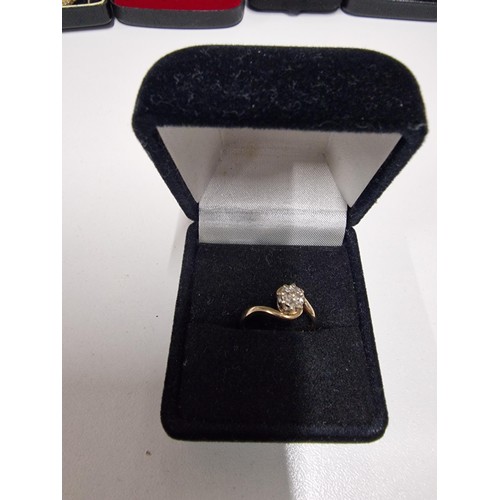 51B - 9ct Gold single diamond twist ring