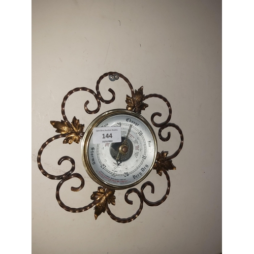 144 - 1950s barometer with metal scroll frame