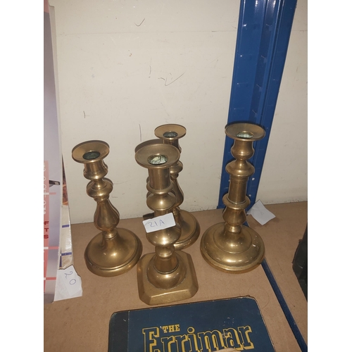 21A - 2 pairs of brass candlesticks