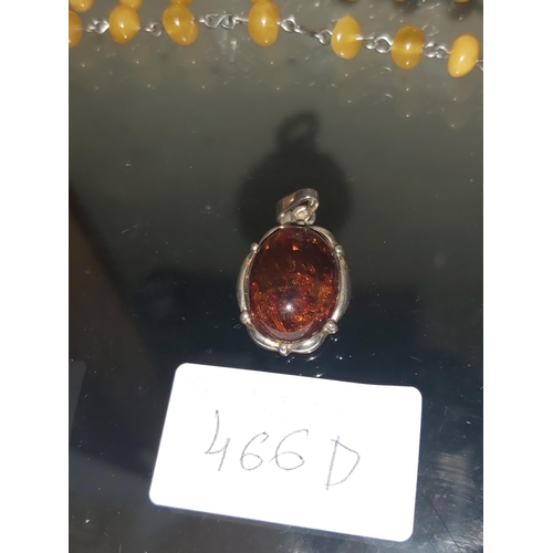 538 - Silver pendant with amber