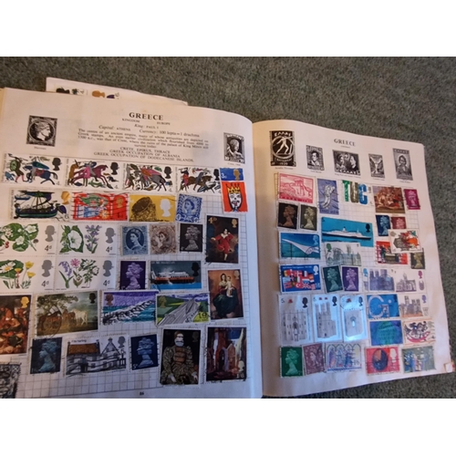 323 - Stanley Gibbons stamp album with loads of stamps