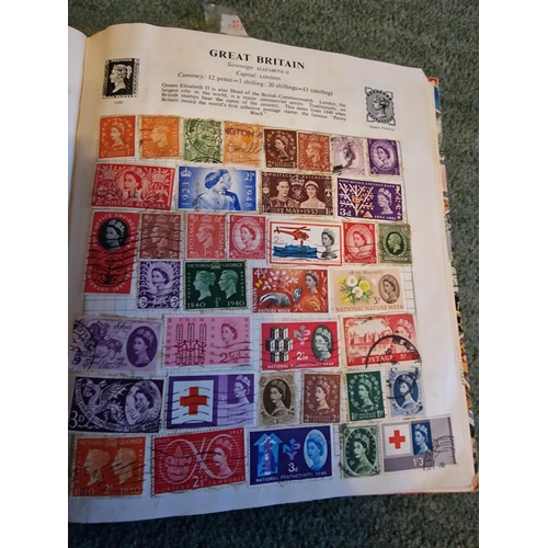 324 - Stanley Gibbons stamp album with loads of stamps