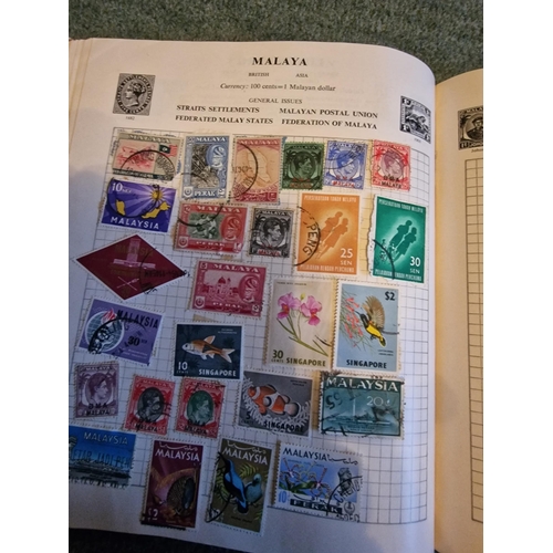 324 - Stanley Gibbons stamp album with loads of stamps