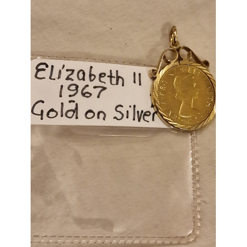 15 - 1967 gold on silver mounted pendant